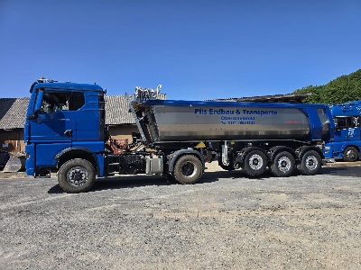 Blue truck on gravel road